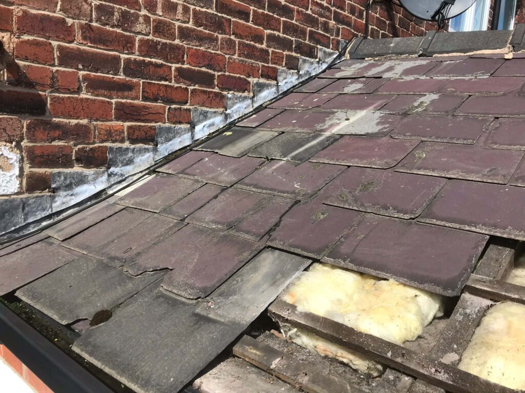 This is a photo of an old small pitched roof which is being stripped by Northampton Roofing Services