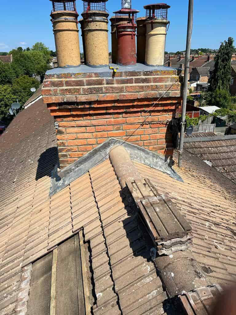 This is a photo of a chimney which has been re-pointed and had new leadwork installed by Northampton Roofing Services