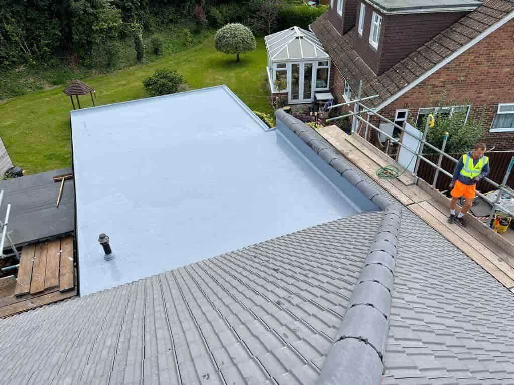 This is a photo of a hip roof with an extension that has a flat roof covered in a liquid roof solution by Northampton Roofing Services