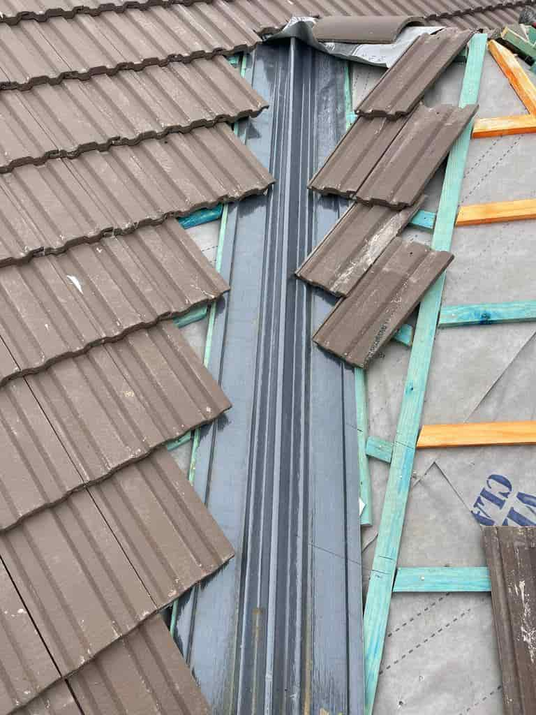 this is a photo of roof tiles being installed by the edge of a roof valley by Northampton Roofing Services